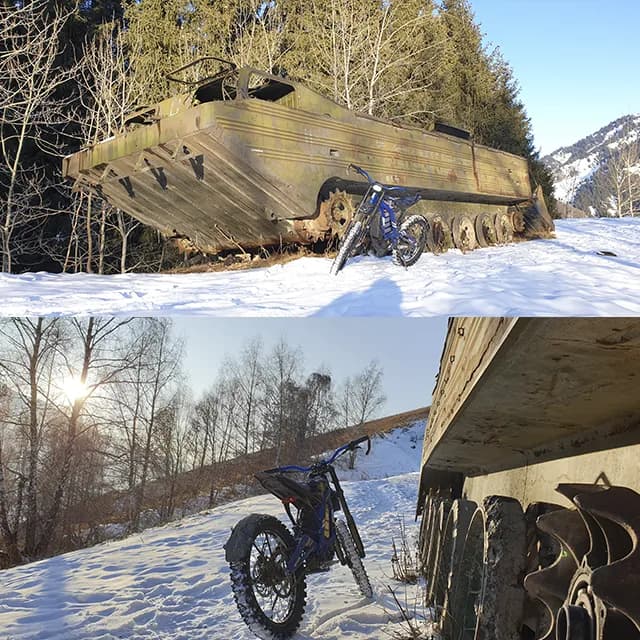 Райдер поднимается по серпантину хребта Бутаковки, далеко внизу город