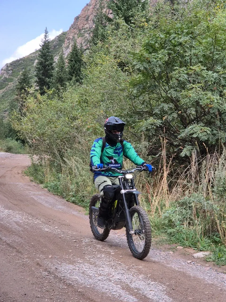 Rider in an xBike jersey on a dirt road