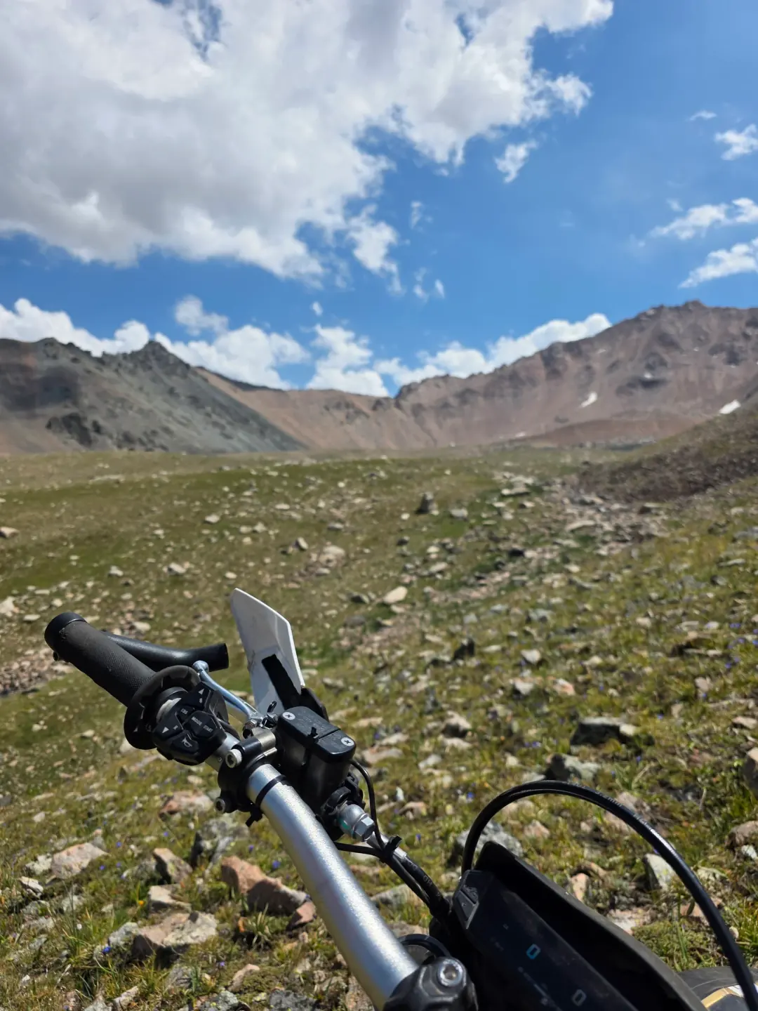 Navigating a rocky moraine trail at 3217m in upper Gorelnik approaching the Titova glacial cirque.